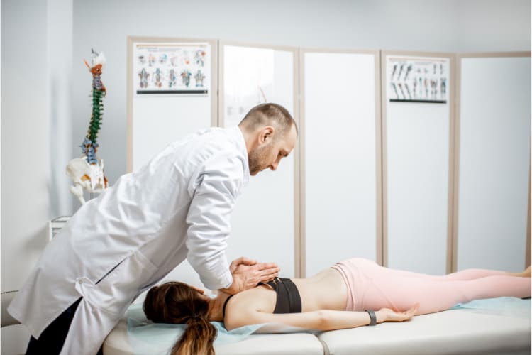 Chiropractor doing some Spinal decompression to the patient.