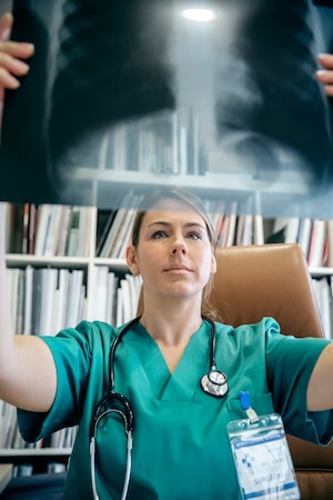 a doctor who's checking the X-ray result of the patient.