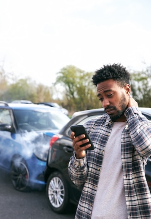 A man is checking his phone for help.