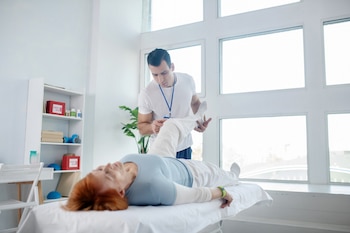 Serious young therapist working with his patient