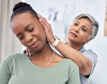 chiropractor with patient messaging neck