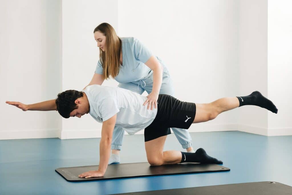 Supervised rehabilitation exercise to restore strength and balance after sports injury.
