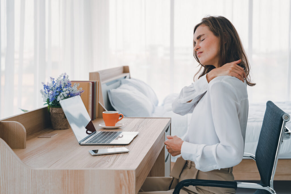 working mom experiencing tense muscle pain